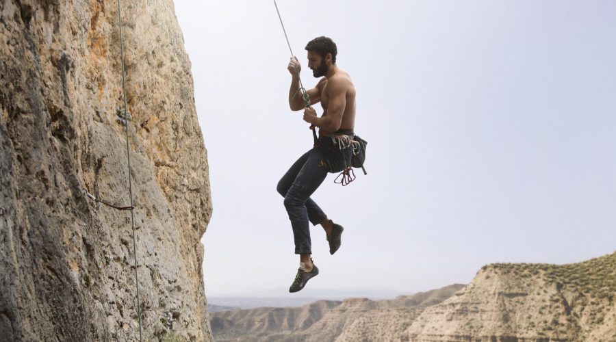 strong-man-climbing-mountain